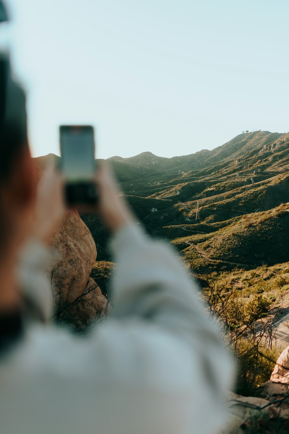 a person taking a picture with a cell phone