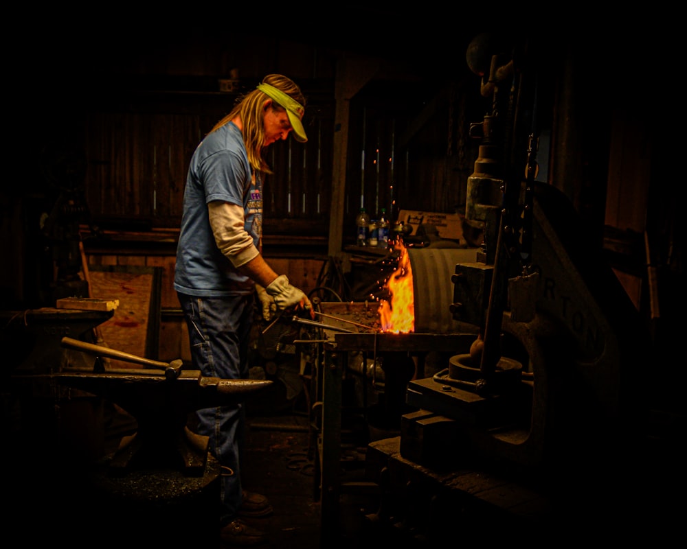 a man working on a piece of metal