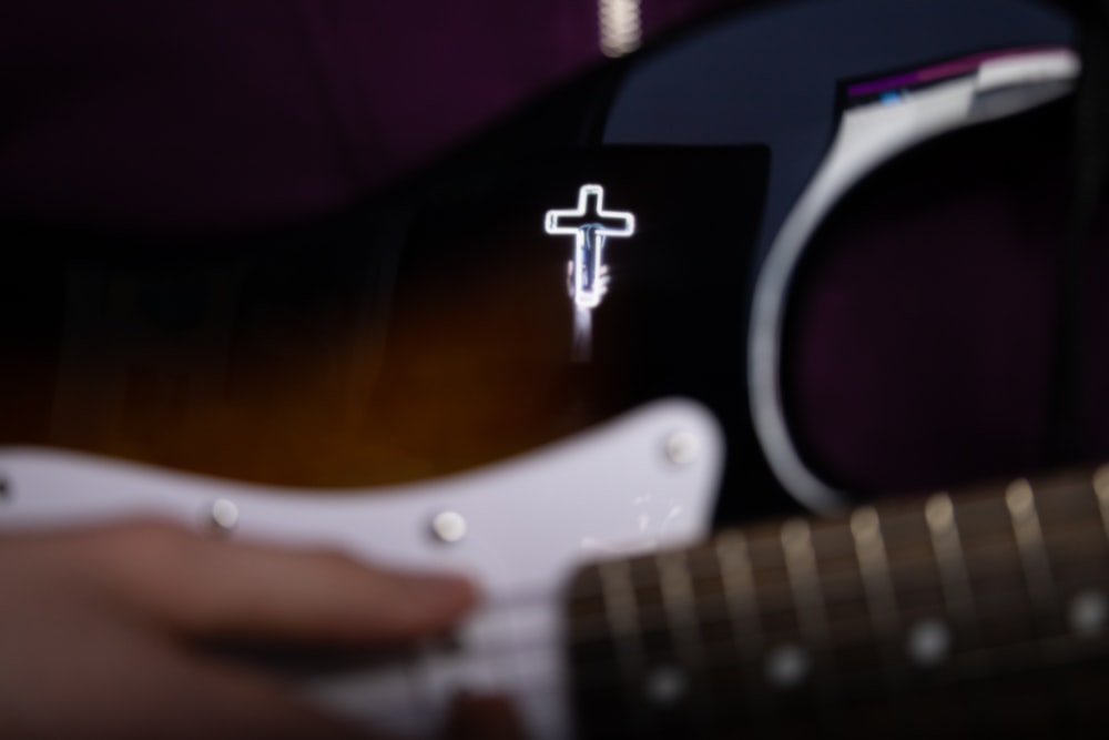 a close up of a person playing a guitar