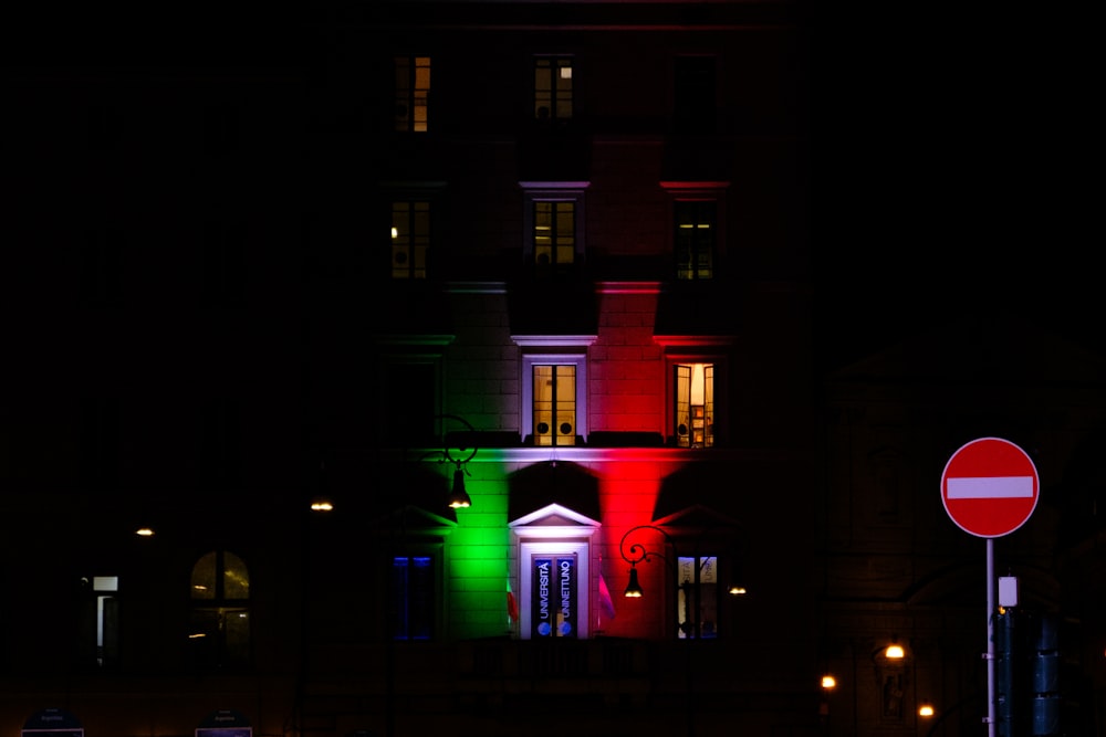 a building lit up in the colors of the flag