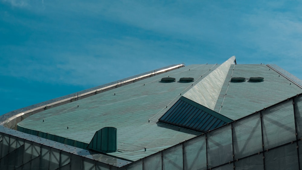 the top of a building with a metal roof