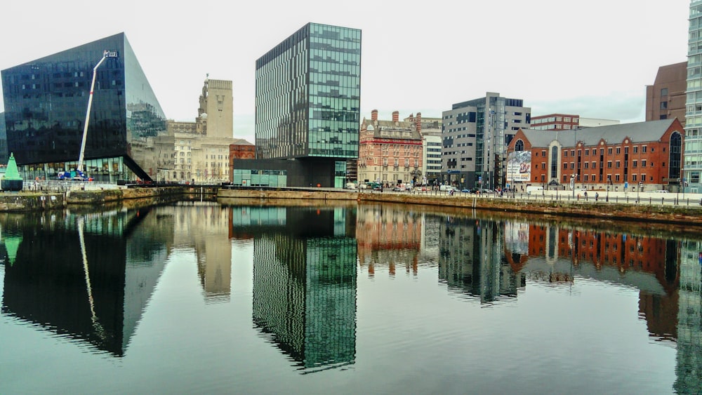 a body of water surrounded by tall buildings