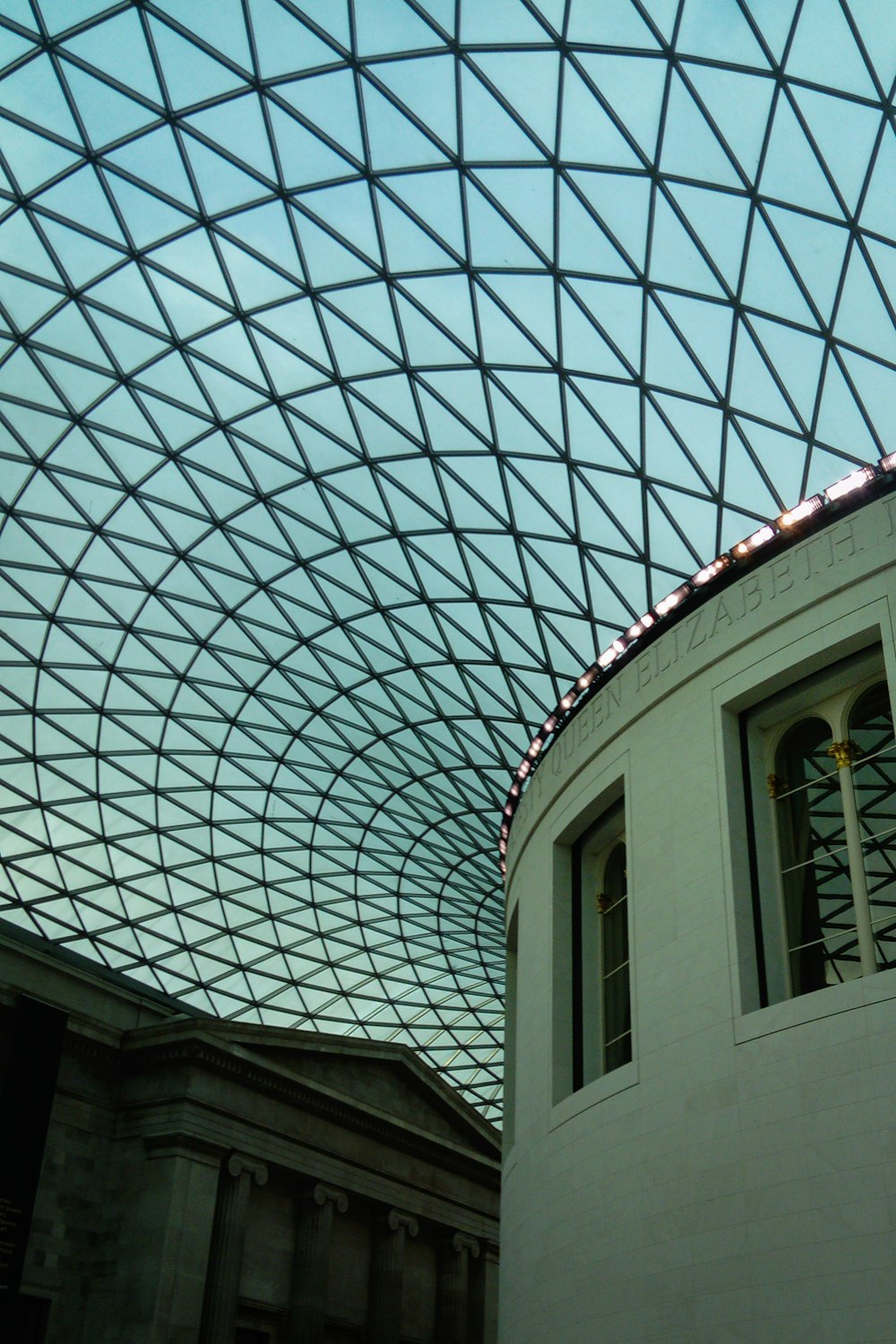 a building with a glass roof and a clock