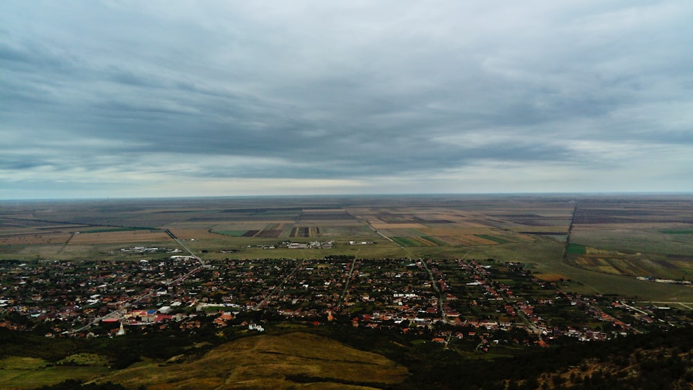 an aerial view of a small town on a hill