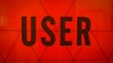 a close up of the word user on a wall