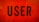 Bold, black typography spells the word 'USER' against a vibrant orange background with geometric triangular patterns.