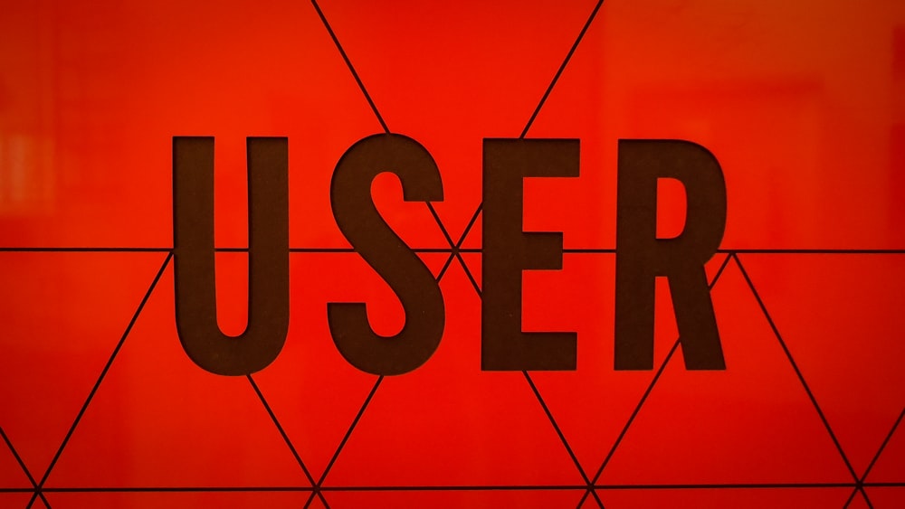 a close up of the word user on a wall