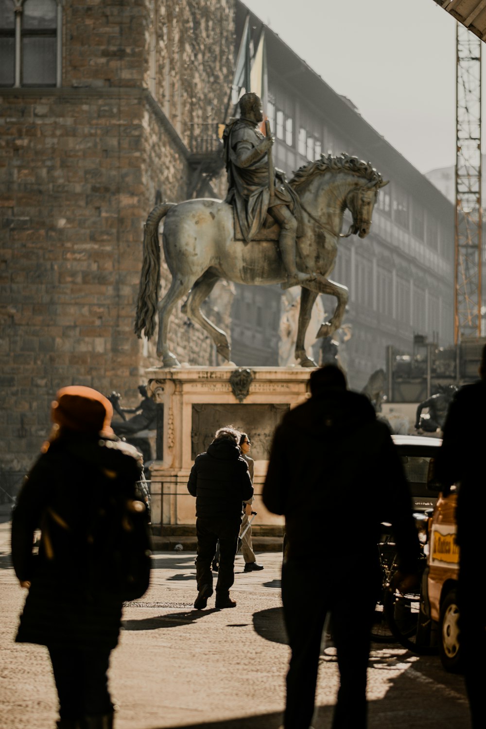 a statue of a man on a horse in a courtyard