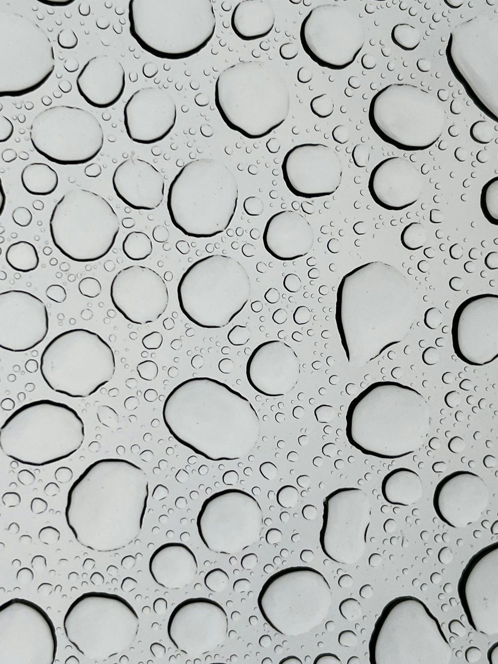 a close up of water droplets on a surface