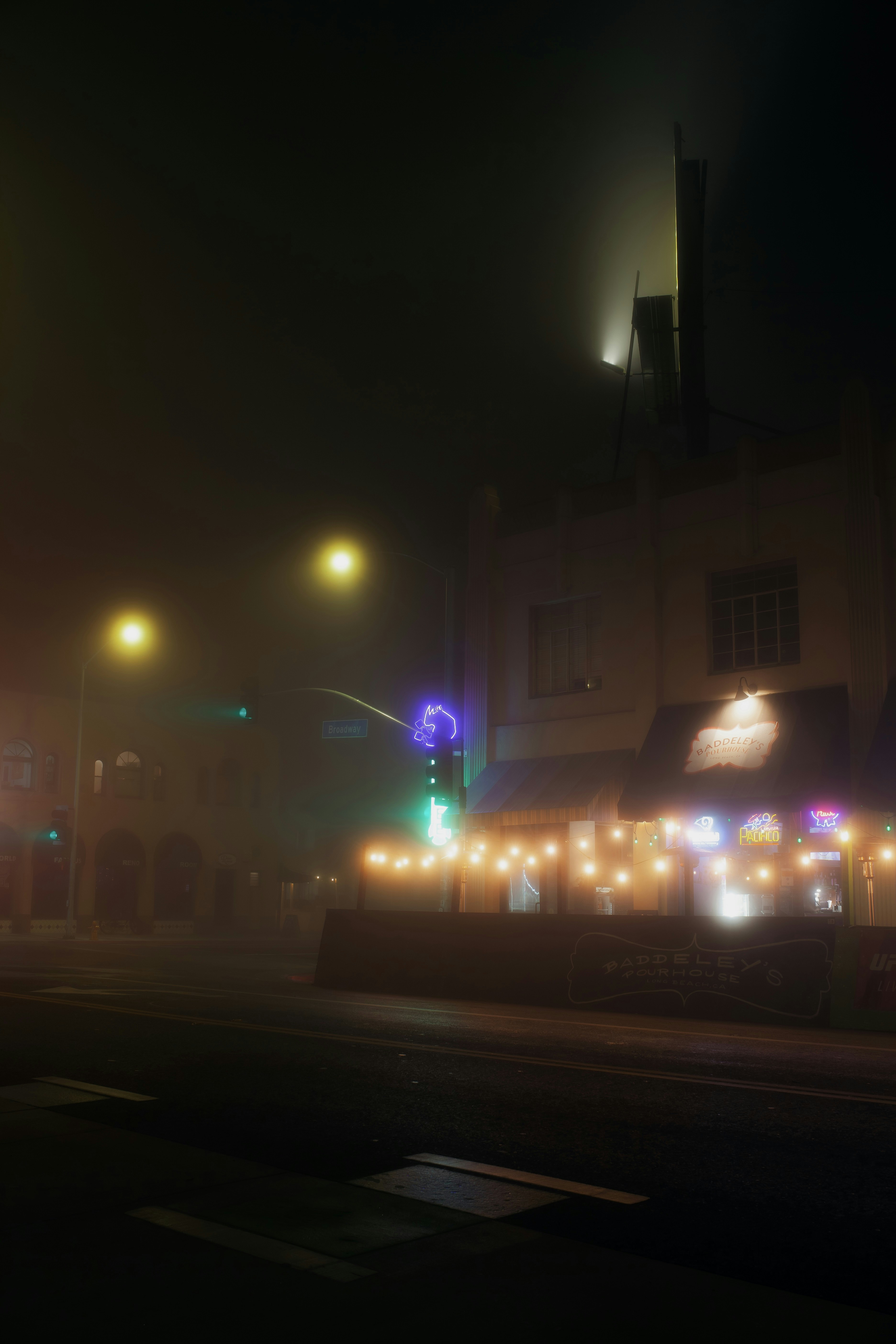 a city street at night with street lights