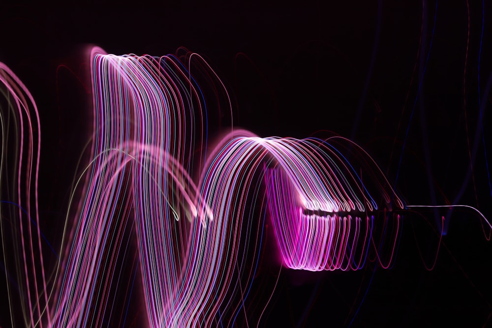 a long exposure photo of light streaks in the dark