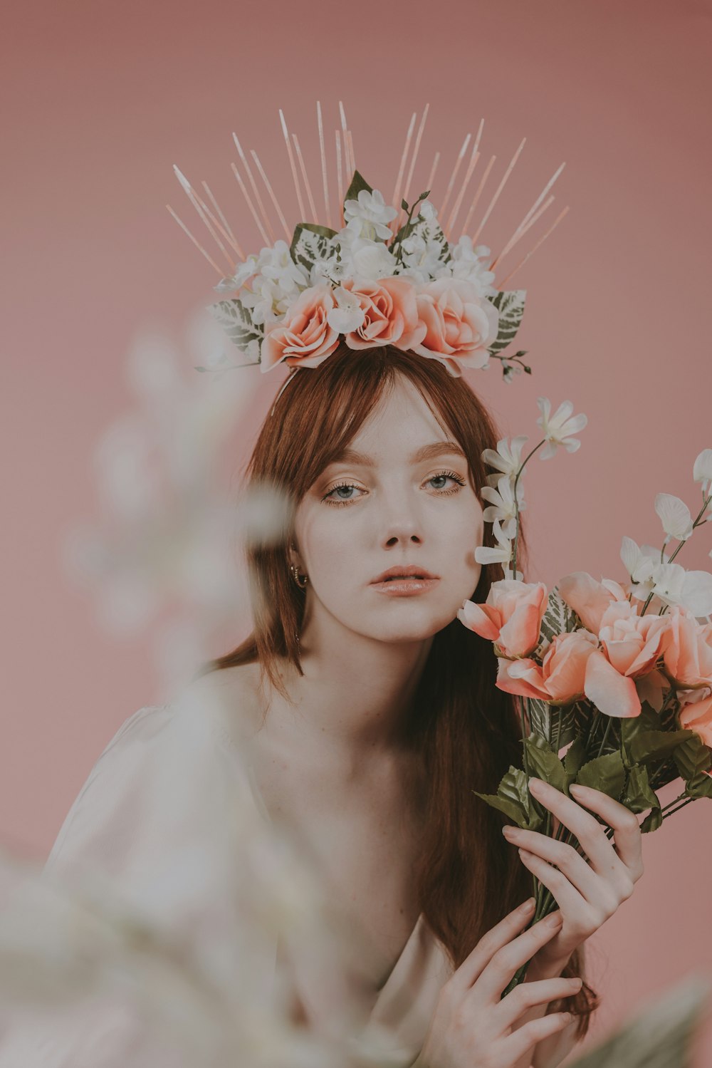 a woman with a flower crown on her head