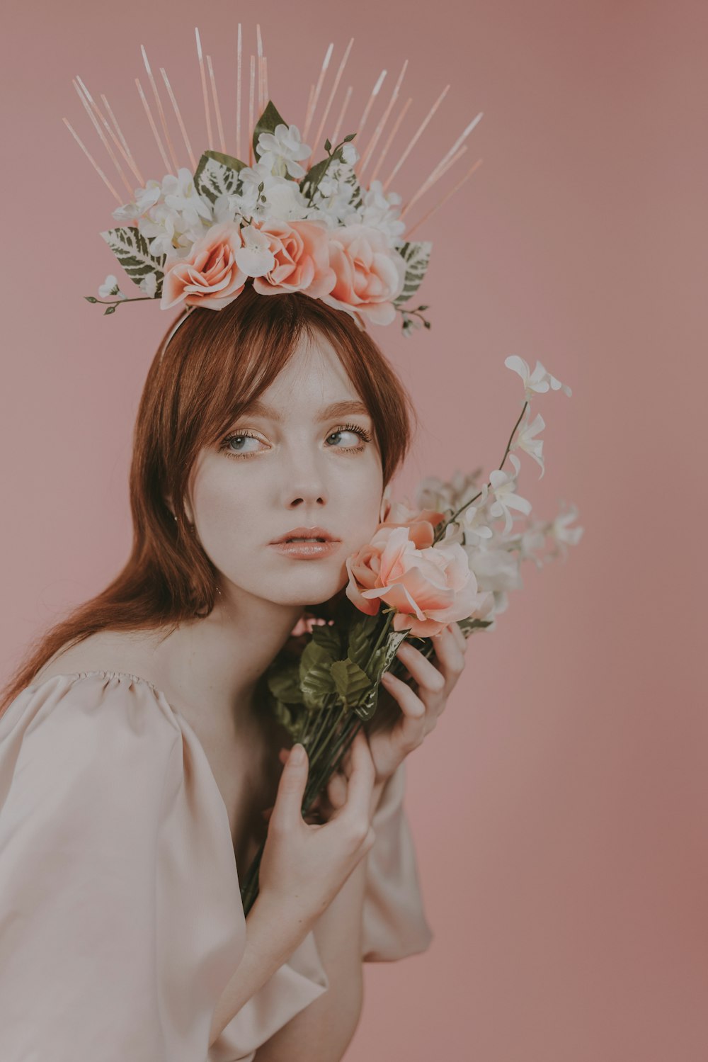 a woman with a flower crown on her head