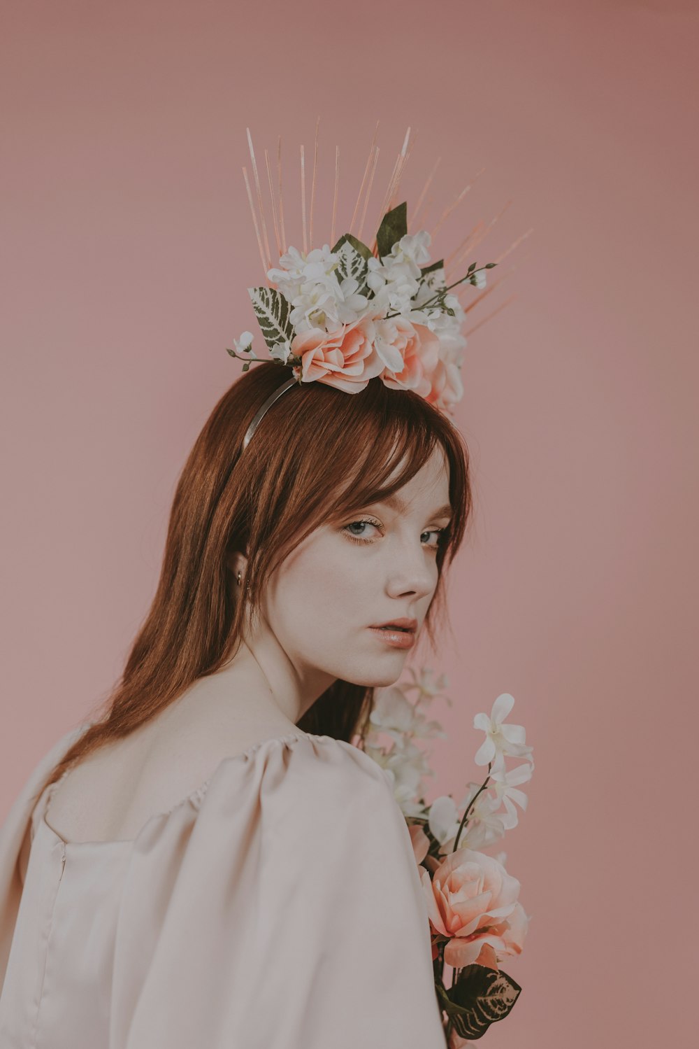 a woman with a flower crown on her head