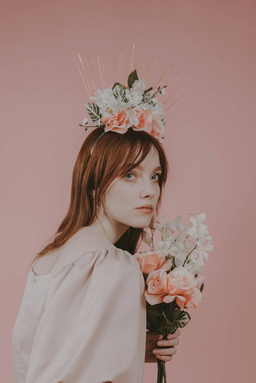 a woman with a flower crown on her head