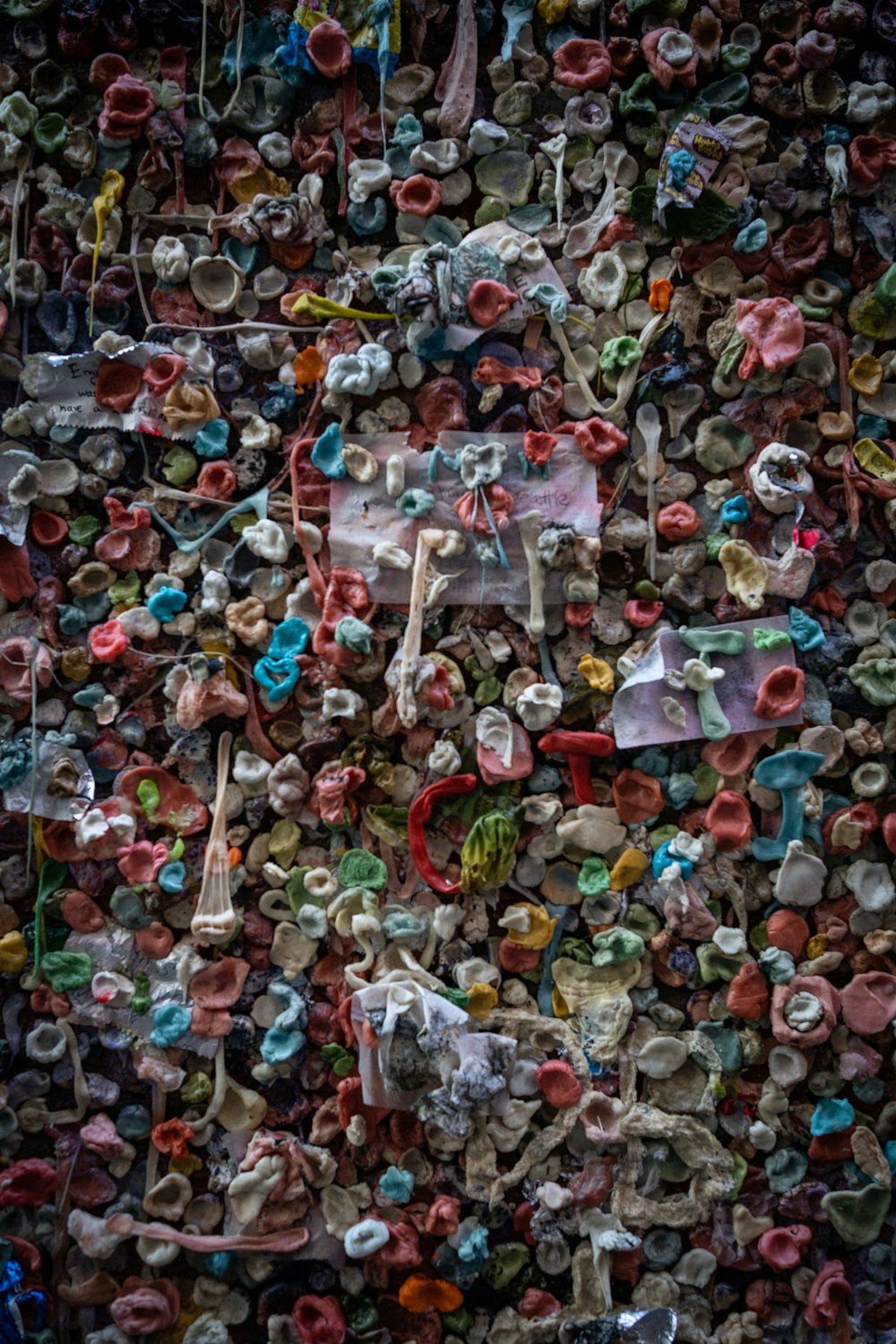 a wall covered in lots of different types of stuffed animals