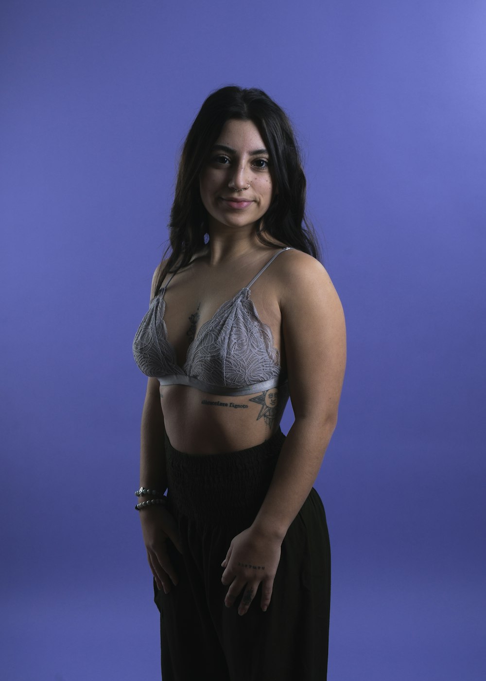a woman in a bra top posing for a picture