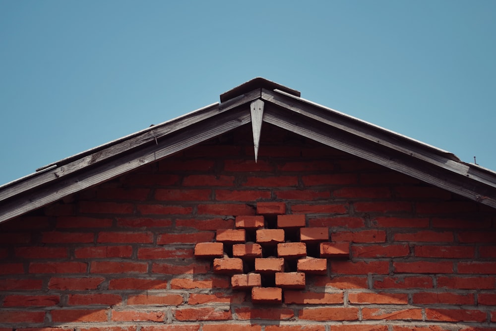 a brick building with a square shaped window