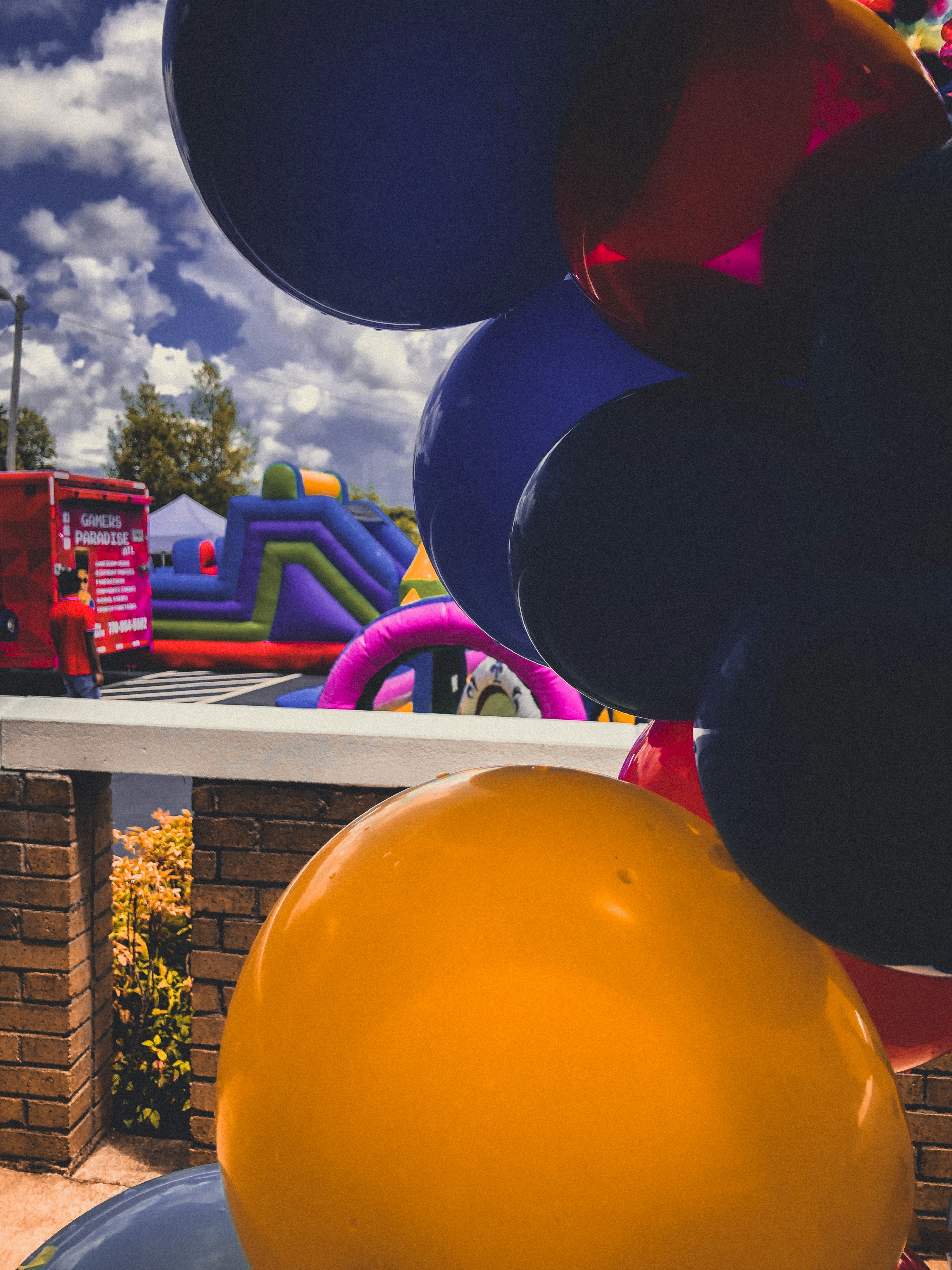 a bunch of balloons that are in the air