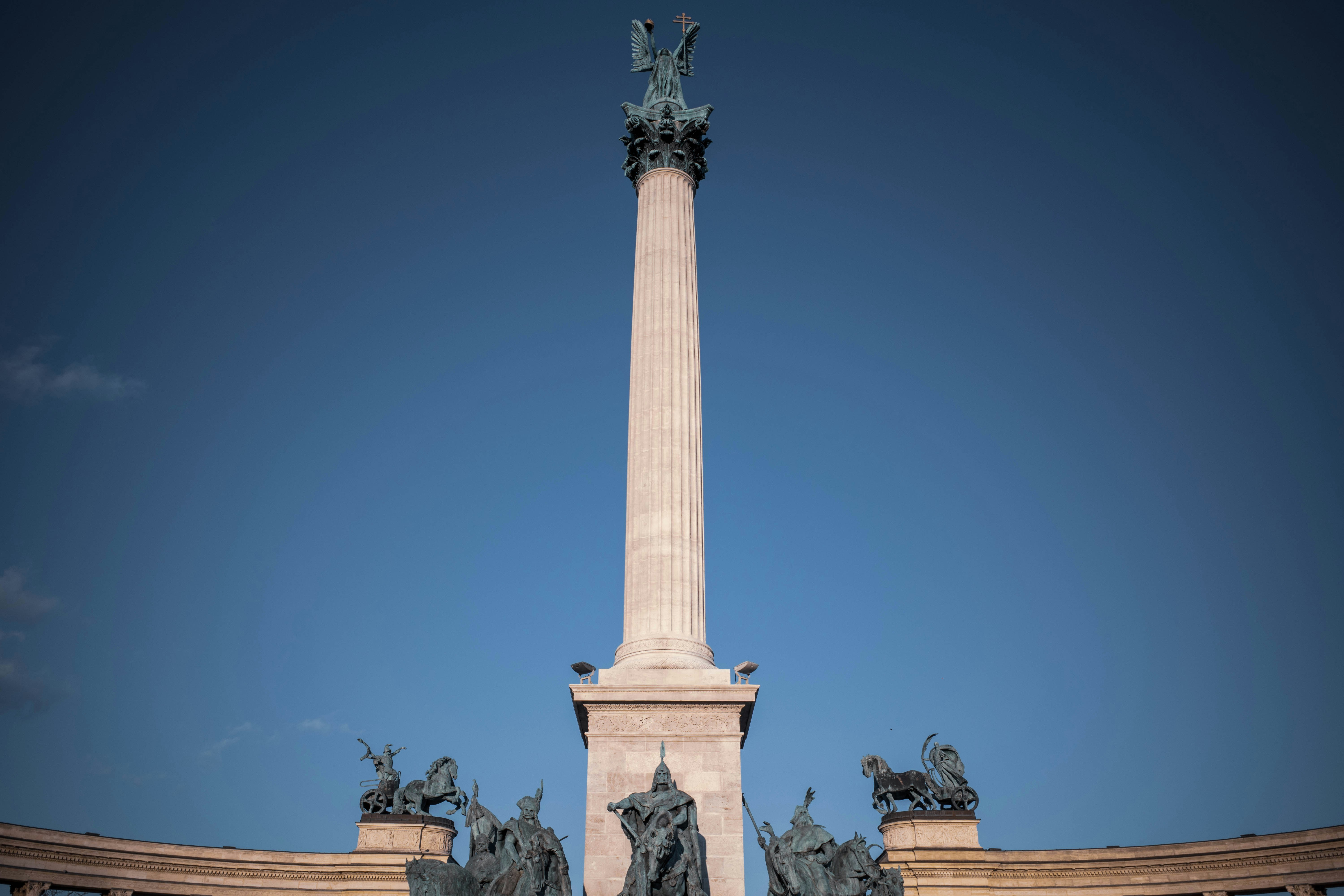 a tall monument with statues on top of it