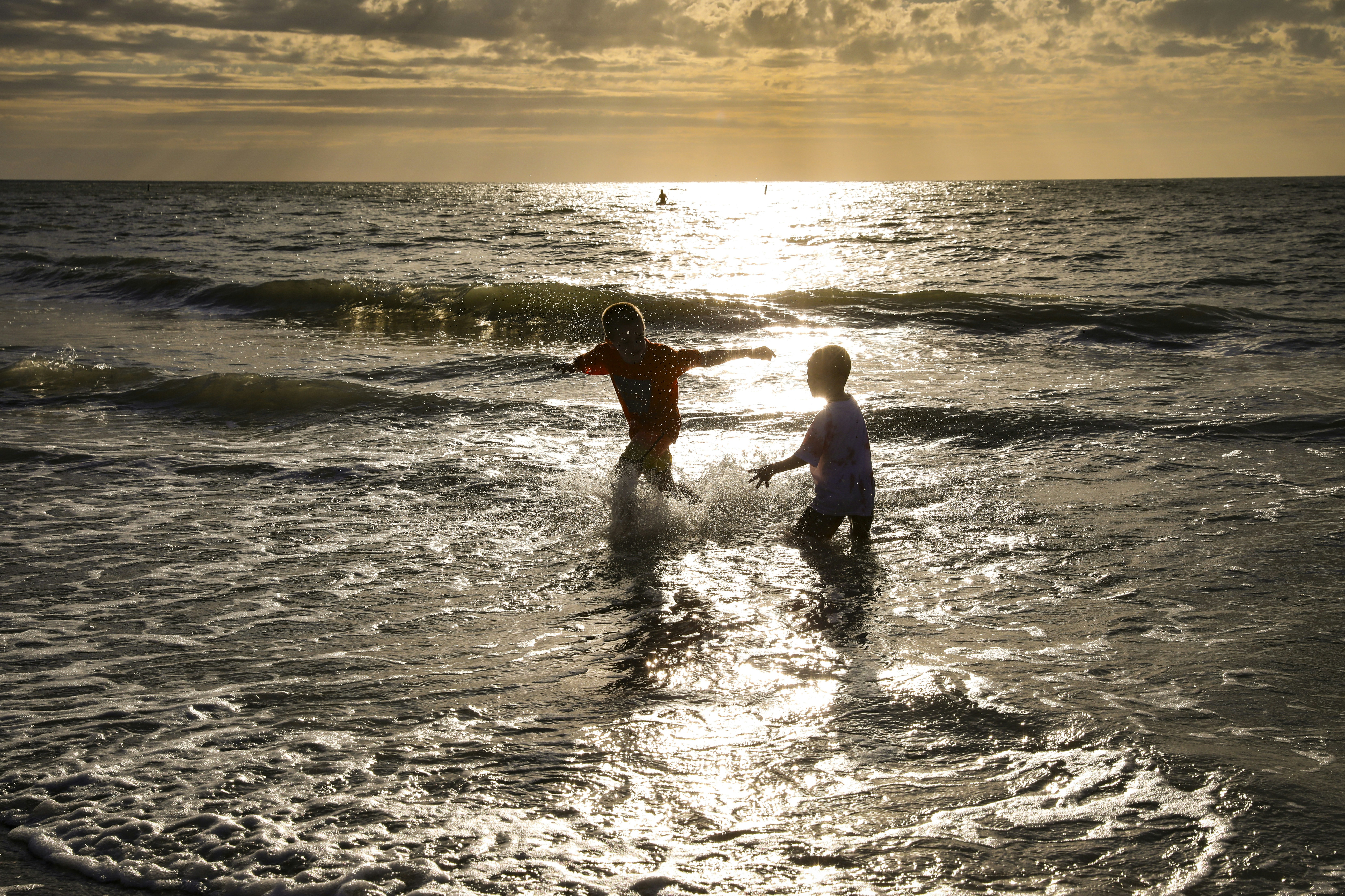 a couple of people that are in the water