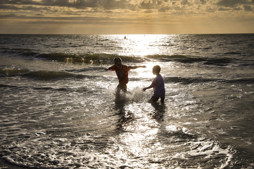 a couple of people that are in the water