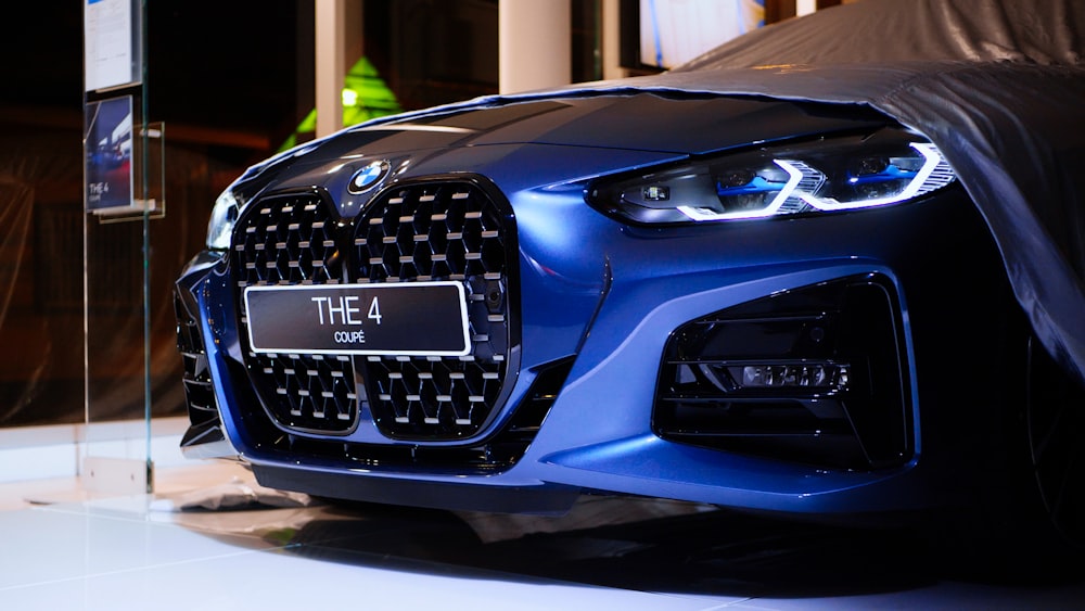 a close up of a car on display at a car show