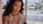 a close up of a person wearing a bikini top