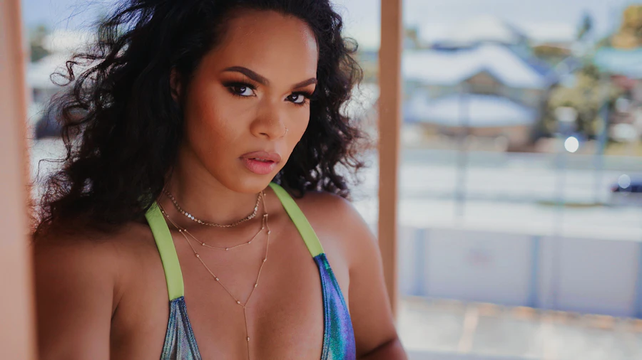 a close up of a person wearing a bikini top