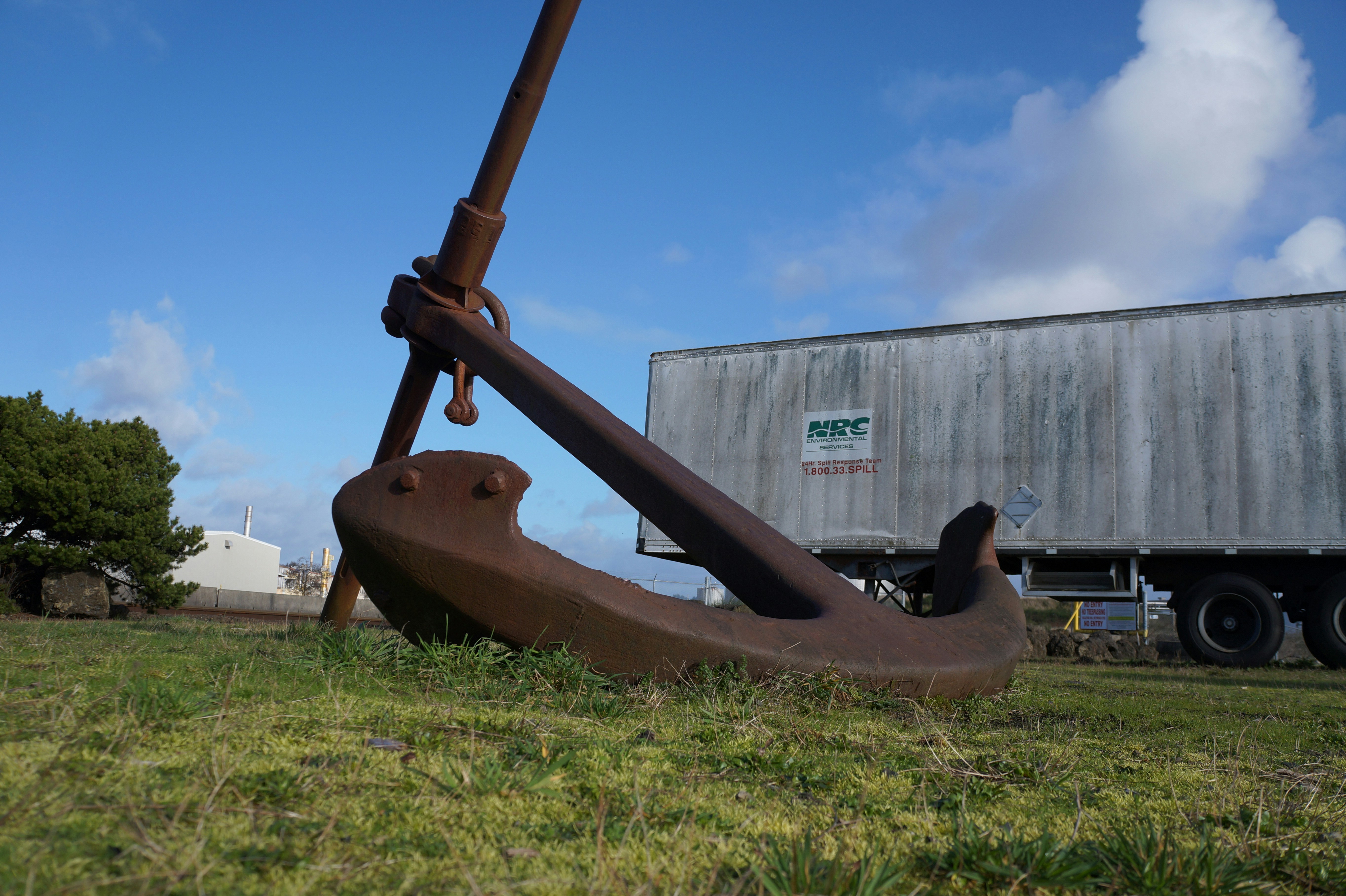 a large piece of art sitting in the grass