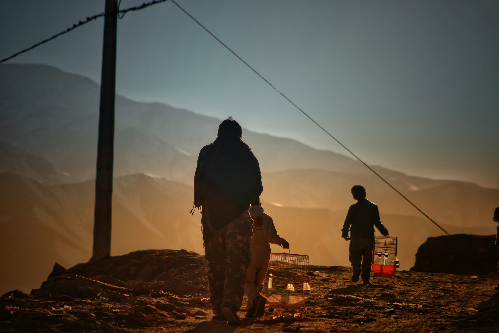 A large group of Afghan children gathered on a dusty field in Kabul — a reminder of how many young lives face hardship