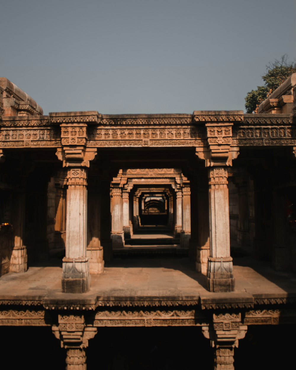 a large building with pillars and pillars in the middle of it