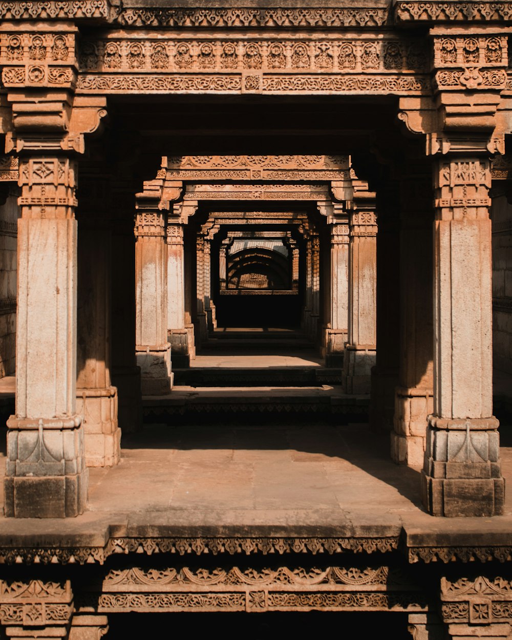 a large stone structure with pillars and arches