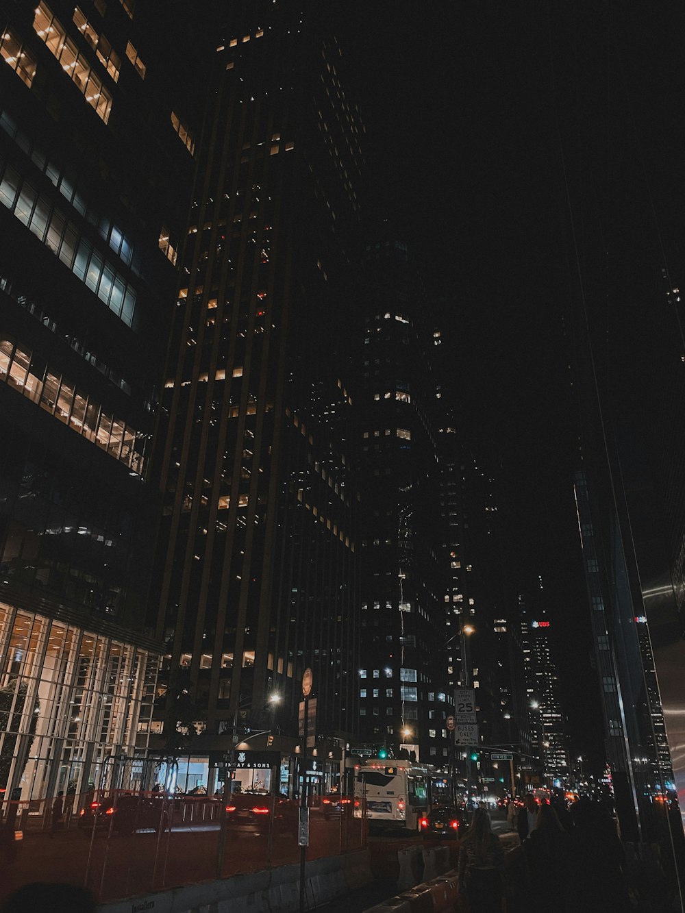 a city at night with a lot of tall buildings