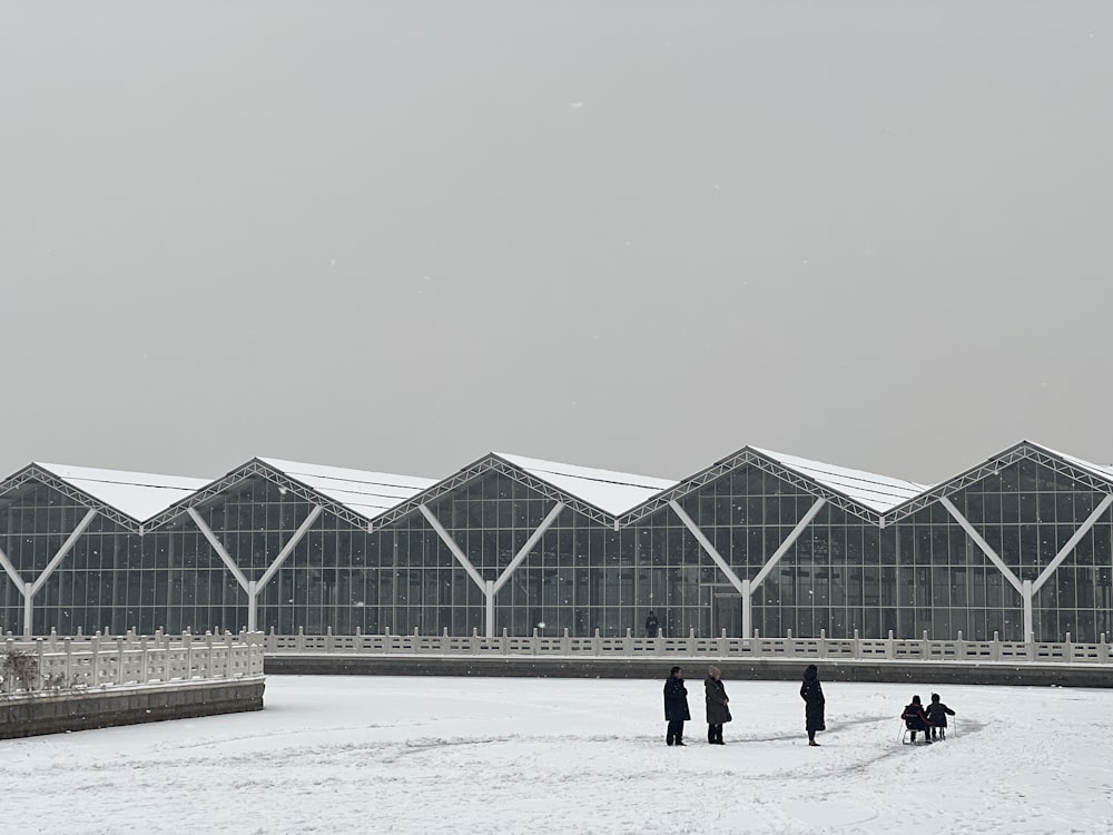 a group of people standing in front of a building