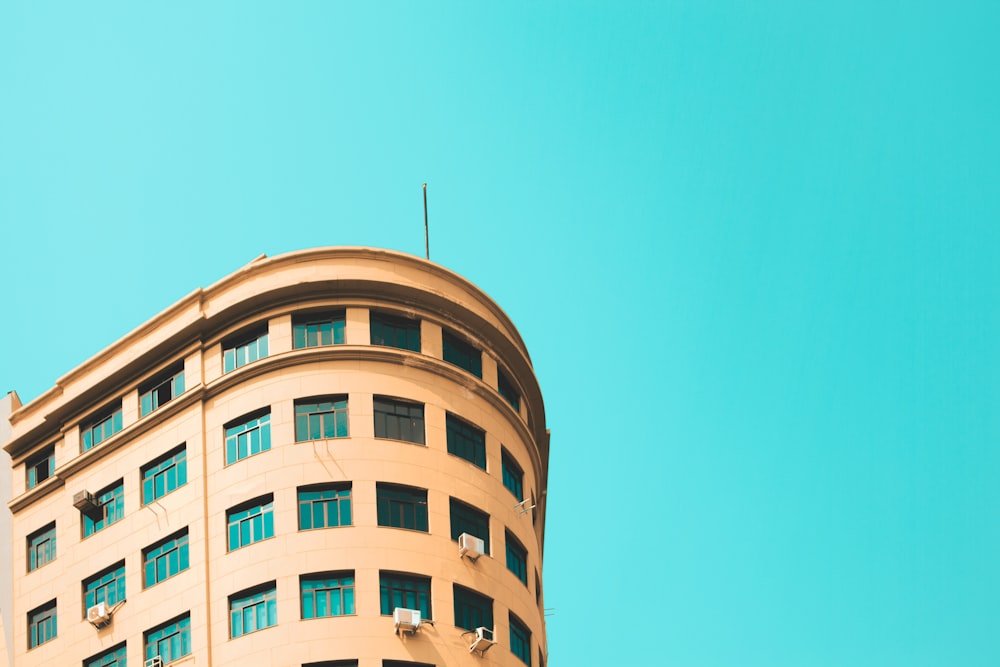 a tall building with a blue sky in the background