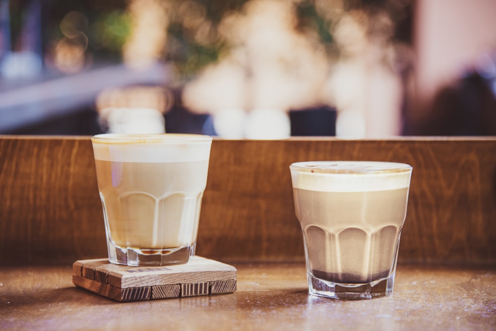 a couple of glasses sitting on top of a table