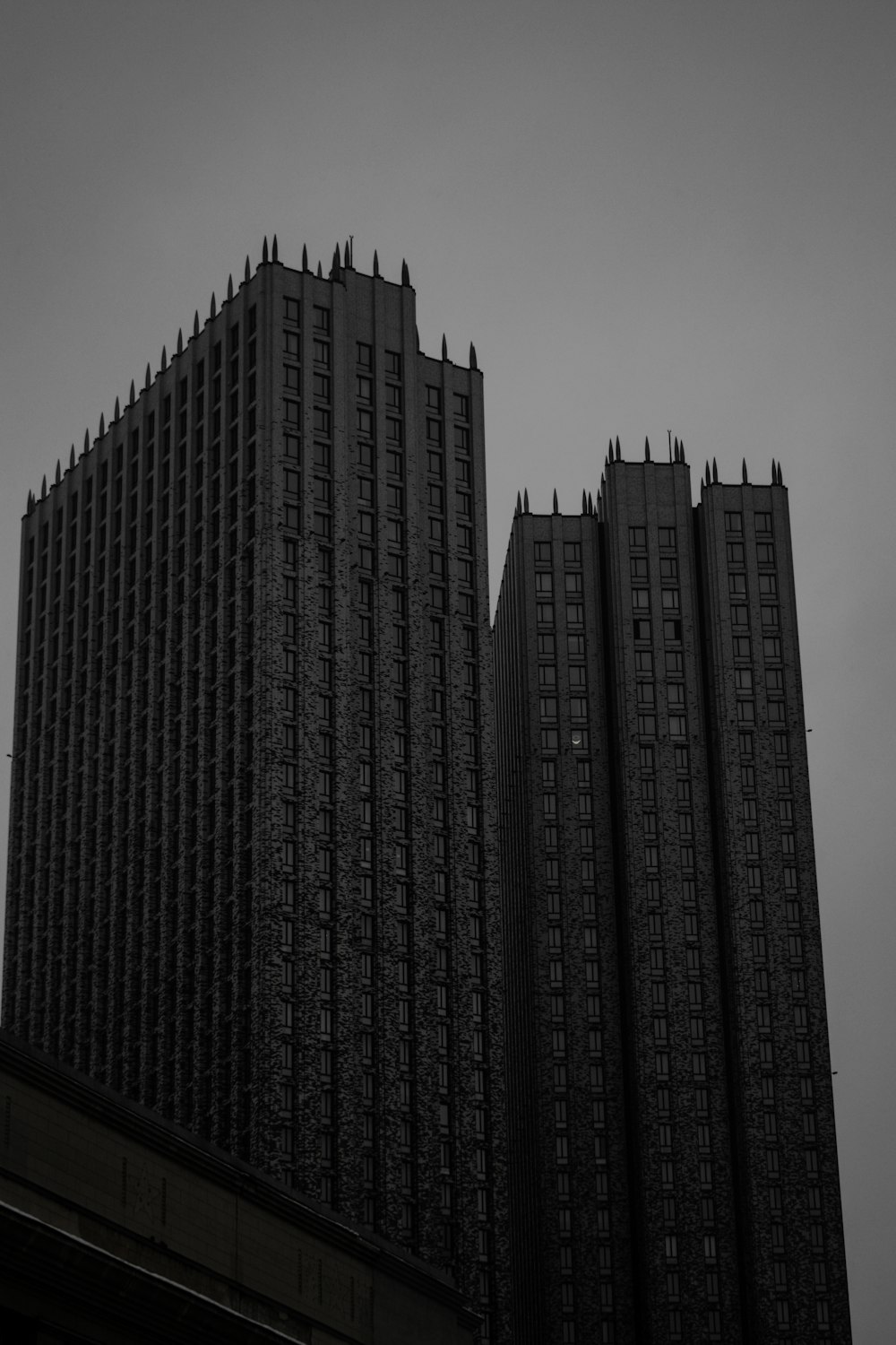 a large tall tower with a clock on the side of a building