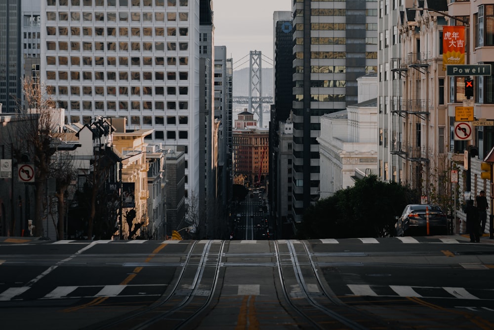 a city street filled with traffic and tall buildings