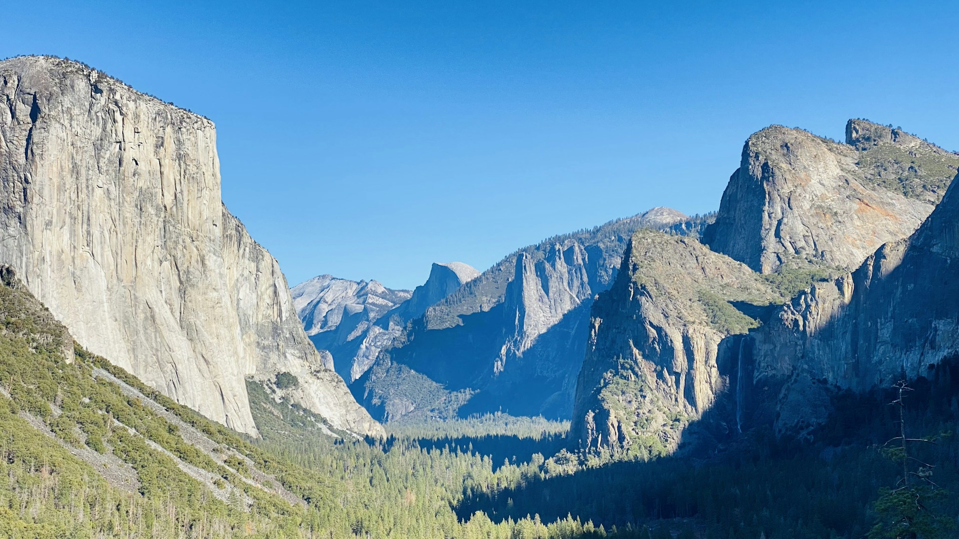 woman wearing yellow long-sleeved dress under white clouds and blue sky during daytime