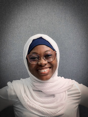 Portrait photo of a female board member with a hijab and a friendly smile
