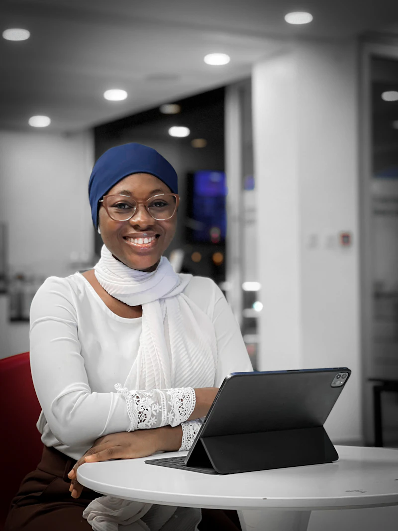 Zimbabwean Professional Accountant with Laptop in Office