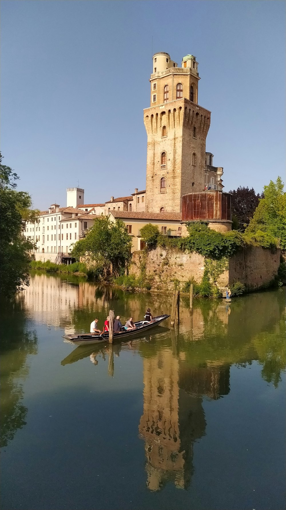 a couple of people in a small boat on a river