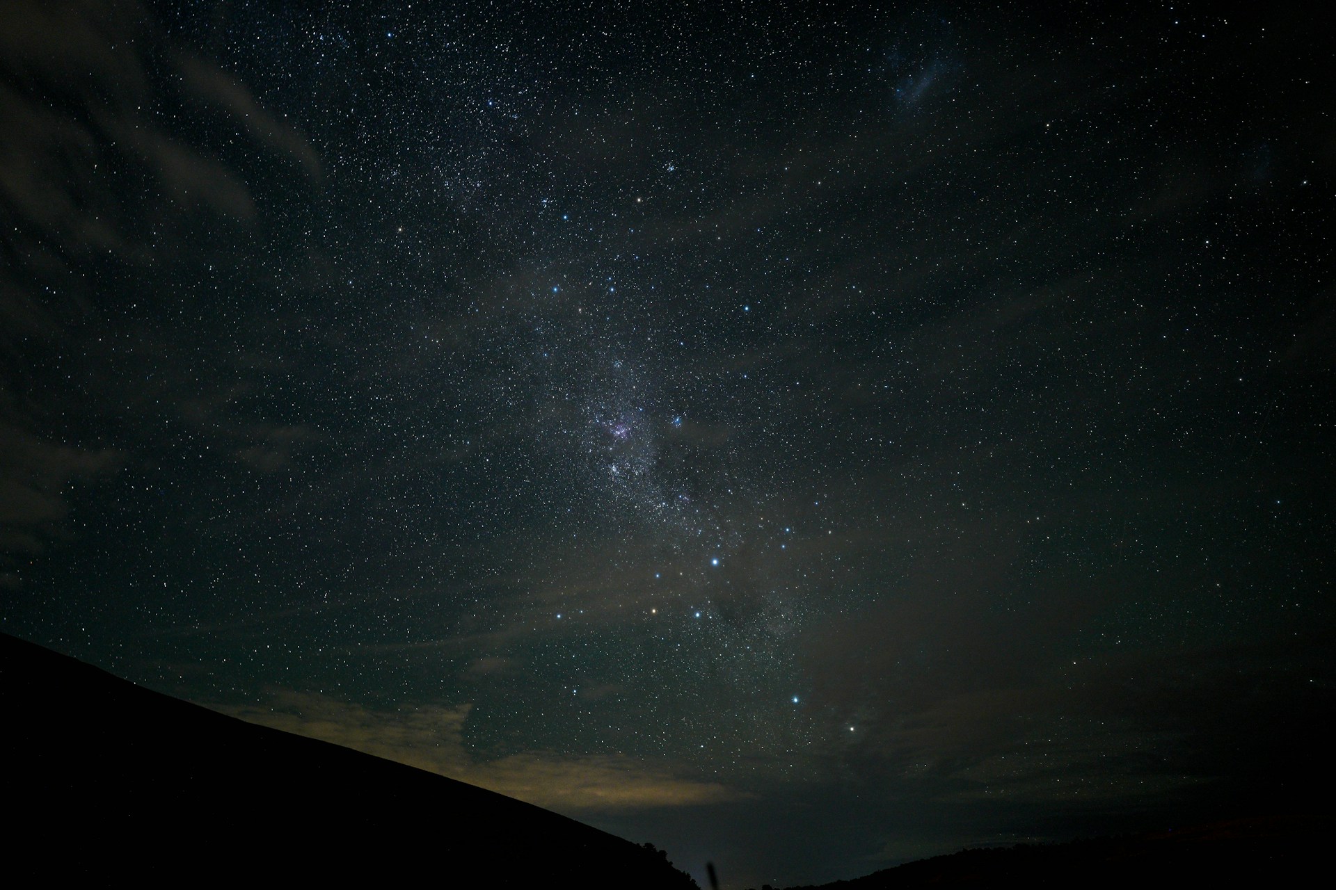 the night sky with stars and clouds
