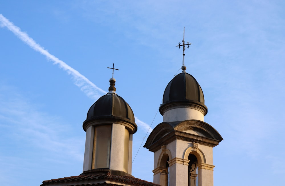 a church steeple with a cross on top