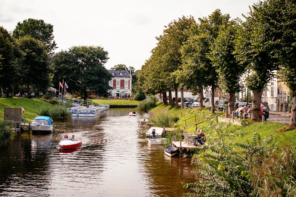 a group of boats floating on top of a river