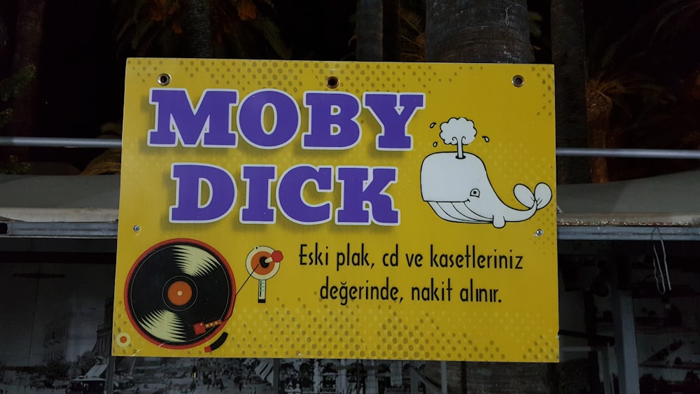 a yellow sign that says moby dick on it