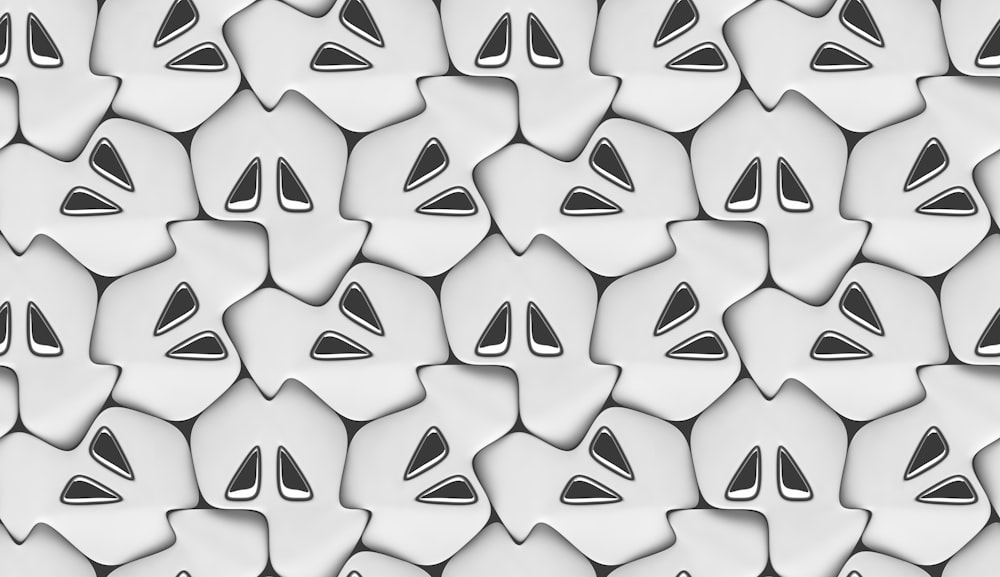 a pattern of white and black shapes on a white background