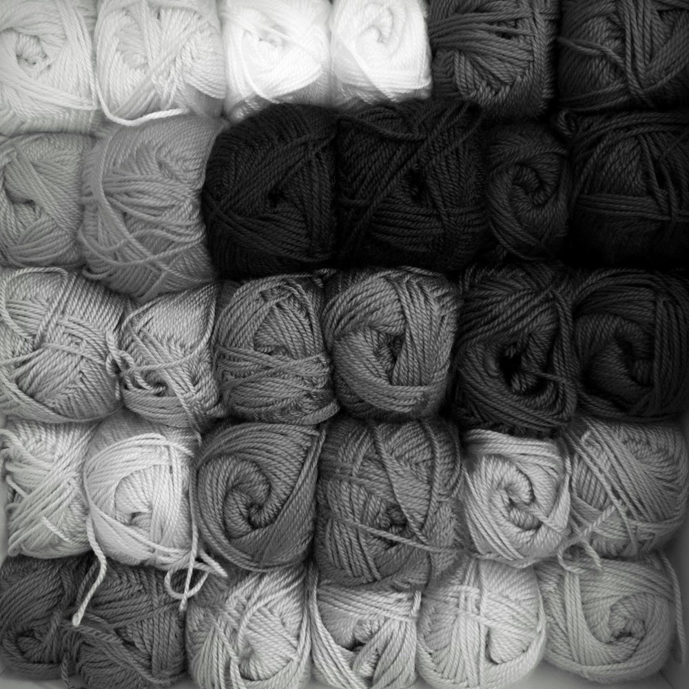 a bunch of balls of yarn sitting on top of each other