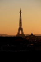 A realistic photo of the Eiffel Tower at sunset with warm light.